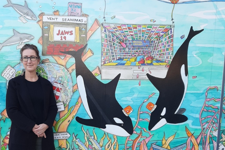 Sarah Pou with one of her new public art murals